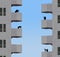 Neighborhood watch is the theme as people with cameras, telescopes and binoculars watch each other from the balconies,