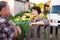 neighbors man and woman chatting near the fence in the village