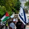 Nelson, New Zealand, 3rd February 2024, Two protestors, one carrying a Palestinian flag, the other with an Israeli flag stand