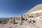 Nemrut ancient ruins statue heads on top of the mountain snowy day blue sky