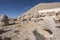 Nemrut ancient ruins statue heads on top of the mountain snowy day blue sky