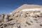 Nemrut ancient ruins statue heads on top of the mountain snowy day blue sky