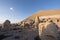 Nemrut ancient ruins statue heads on top of the mountain snowy day blue sky