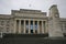 Neo-classical stone Memorial War Museum with main entry on grand stairs and historic WW1 and WW2 cenotaph in Auckland, New Zealand