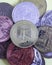 neo cryptocurrency coin on the background of multicolored coins of various cryptocurrencies close up
