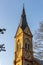 Neo-gothic tall spire at sunset.