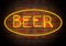 Neon Beer Sign on A Face Brick Wall