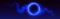Neon blue circle in sparkling cloud of smoke