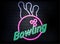 Neon bowling sign on brick wall background