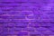 Neon colored brick wall background. Horizontal toned backdrop