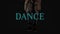 Neon dance text over woman dancing against black background
