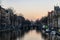 Neon evening lights reflected in the Canals of Amsterdam, The Netherlands