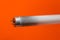 Neon or fluorescent bulb tube which is burnt or bad as it can be seen as there is black or dark part of glass near the edge of a