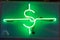 Neon green dollar sign in a dark room