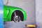 Neon green sportcar in the service station for tire and wheel re