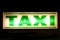 Neon green taxi sign