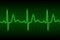 Neon heart beat ecg or ekg seamless line on green background