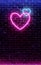 Neon heart. Bright night neon on brick wall