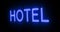 Neon hotel sign outside guest house room - 4k