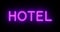 Neon hotel sign outside guest house room - 4k