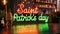 neon illuminated banner text Saint Patrick's day on the bar counter, poster, banner