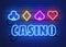 Neon lamp casino banner on wall background. Poker or blackjack card games sign. Las Vegas concept.