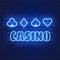 Neon lamp casino banner on wall background. Poker or blackjack card games sign. Las Vegas concept.