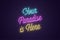Neon lettering of Your Paradise is Here. Glowing text
