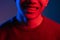 neon light smile positive emotion man face red