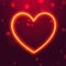 Neon lighting effect heart shape on red bokeh background.