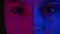 Neon lights portrait woman eyes pink blue glow