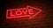 Neon love sign above entrance is advertising for nightclub or massage - 4k