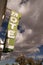 Neon Motel Sign Clear Blue Sky White Billowing Clouds