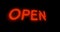 Neon open sign glowing and illuminated at a store entrance - 4k