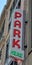Neon Park Here sign