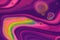 Neon pink and purple intermingle with a rainbow of bright colors in this abstract background.