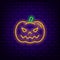 Neon pumpkin icon on dark brick background.