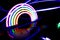 Neon rainbow with swirling lights