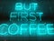 A neon sign that say `but first coffee`