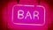 Neon sign saying BAR nightlife straight shot