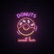 Neon sign of Sweet Donuts. Neon cafe emblem, bright banner. Advertising design.