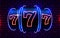 Neon slot machine wins the jackpot. 777 Big win casino concept.