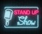 Neon stand up show sign with retro microphone on a brick wall background. Comedy battle glowing signboard.