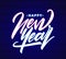 Neon type lettering of Happy New Year on dark wall background