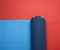 Neoprene blue twisted mat lies on a red background, sports equipment