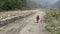 Nepal, anapurna. walking people along river. aerial footage