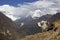 Nepal, the Himalayas, the Everest region. A shaggy Yak stands against a mountain landscape. Behind you can see mount AMA Dablam -