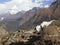 Nepal, the Himalayas, the Everest region. A shaggy Yak stands against a mountain landscape. Behind you can see mount AMA Dablam -