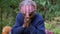 Nepal - November 11, 2018: portrait authentic old wrinkled Nepalese woman praying