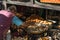 Nepalese man cooking fried street food